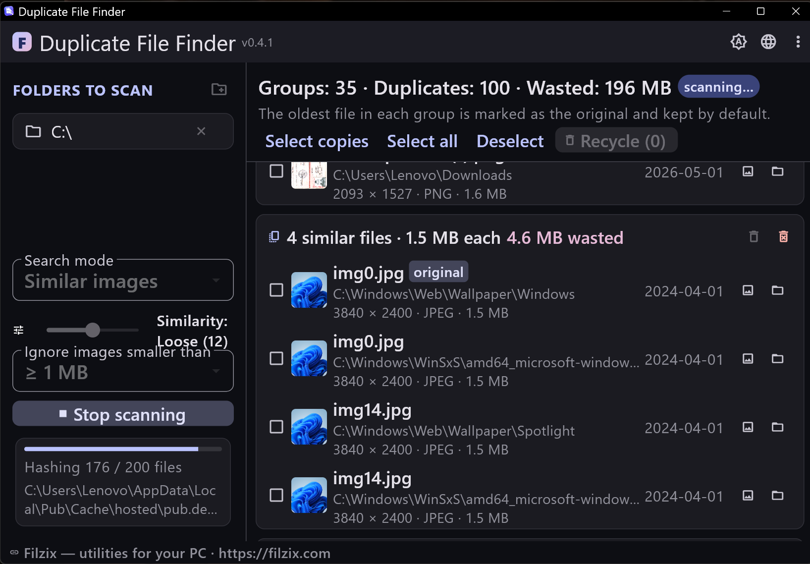 Similar photos mode: the duplicate photo finder shows live results with image previews while the scan is still running